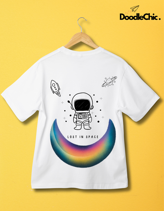 Space by DoodleChic - 100% Organic Cotton White Printed Kids T-shirt with astronaut and space doodles, hanging on wooden hanger with yellow wall.