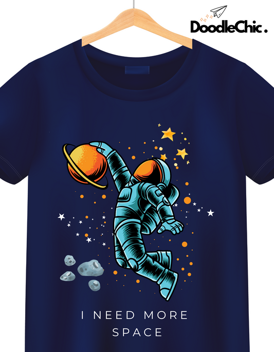 Close-up of Space by DoodleChic-100% Organic Cotton Navy Blue Printed Kids T-shirt with astronaut and stars graphic for space-loving kids.