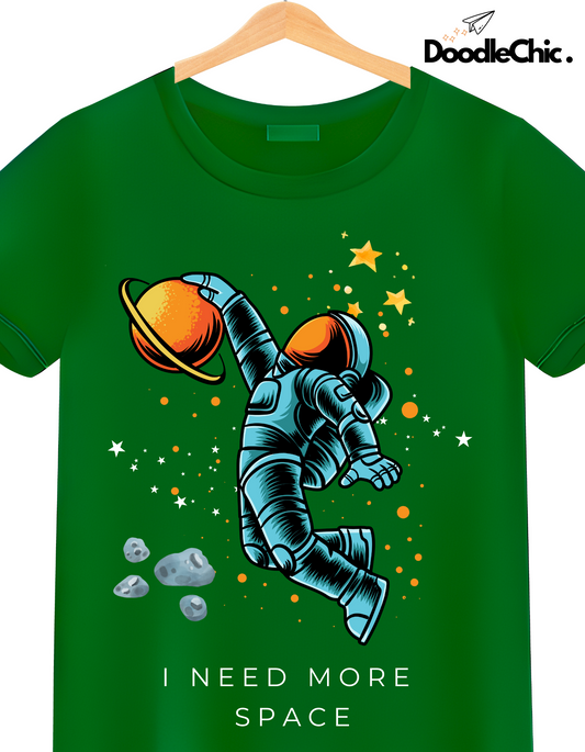 Close-up of Space by DoodleChic - 100% Organic Cotton Green Printed Kids T-shirt showing astronaut and space-themed design.