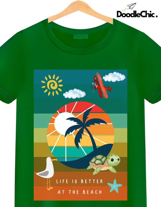 Close-up of Beach by DoodleChic - 100% Organic Cotton Green Printed Kids T-shirt with colorful beach-themed illustration and 'Life is Better at the Beach' text.