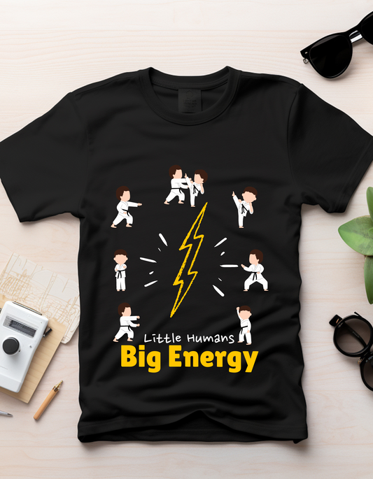 Little Humans by DoodleChic - 100% Organic Cotton Black Kids T-shirt laid flat with karate-themed print and bold yellow text.
