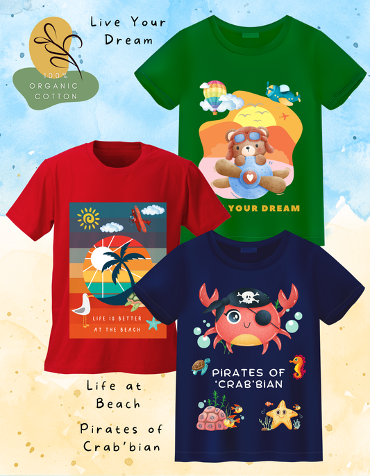 DoodleChic Pack of 3 Kids 100% Organic Cotton T-shirts featuring 'Pirates of Crab'bian', 'Live Your Dream', and 'Life at Beach'. Three children's t-shirts with colorful designs and text on a light blue background.