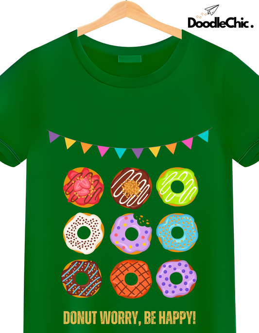 Close-up of Donut Worry Be Happy-DoodleChic 100% Organic Cotton Green Kids T-shirt showing vibrant donut prints and cheerful banner design.