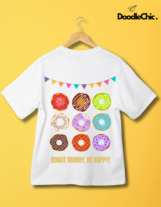 Back view of Donut Worry Be Happy-DoodleChic 100% Organic Cotton White Kids T-shirt with vibrant donut print and festive flags on hanger.