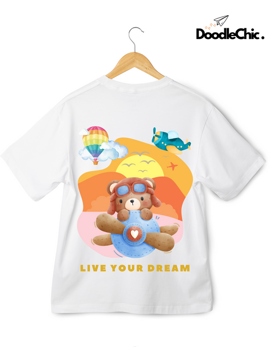 Live Your Dream by DoodleChic - White Organic Cotton Kids T-shirt with dreamy aviation-themed bear print, perfect for playful everyday wear.