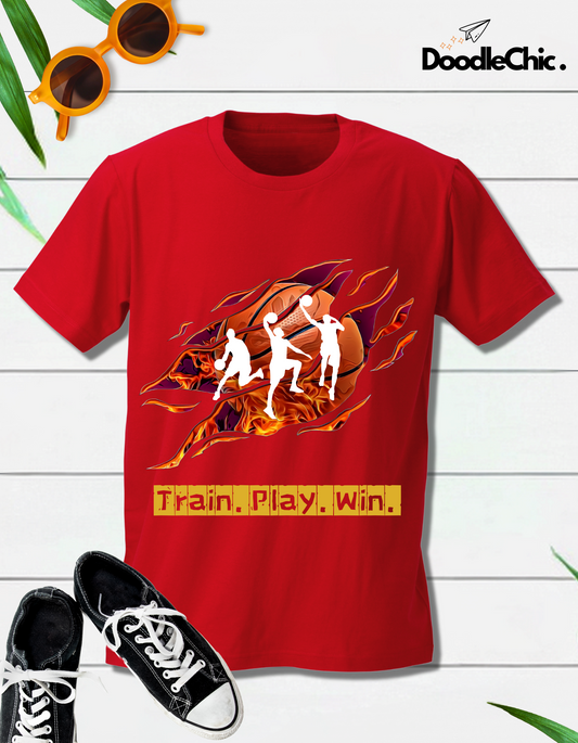 Flat lay of Train Play Win - DoodleChic Kids' Red T-shirt with sneakers and sunglasses, showcasing bold basketball design for sporty kids' fashion.