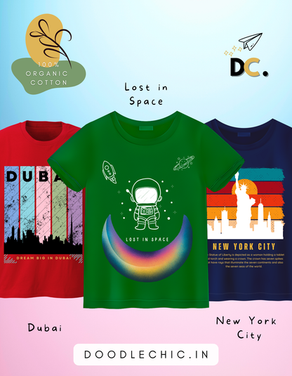 DoodleChic Pack of 3 Kids 100% Organic Cotton T-shirts featuring 'Lost in Space', 'New York City', and 'Dubai'.